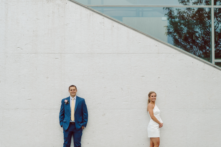 Colleen and Patrick had an intimate wedding ceremony at their church in Queens, NY then we went over to Gantry Plaza State Park LIC for their wedding photos. Colleen and Patrick's NYC elopement was nothing but fabulous and spectacle. When I saw all the food trucks lined up along Gantry Plaza State Park I knew I wanted to use it as our backdrop for Colleen and Patrick. Of course we chose "Mr Softee's Ice Truck" and as we were taking the photo one of Colleen and Patrick's cousin walked by doing the most epic photobomb ever! Colleen and Patrick's NYC elopement Gantry Plaza State Park LIC captured by NY NJ Weddings, Elopements and Family Photographer Karis by Hey Karis.